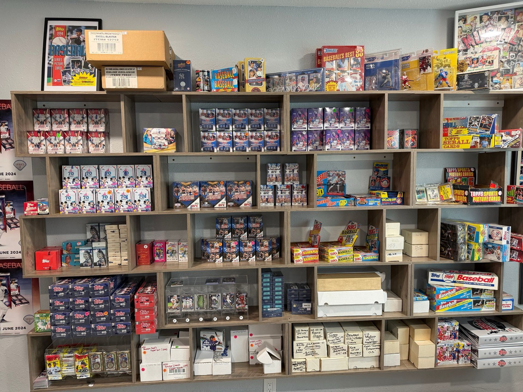 Wooden shelves stacked with baseball card boxes and vintage packs